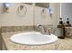 Bathroom sink with granite countertop, mirror, and brushed nickel faucet at 2550 N Alafaya Trl # 2304, Orlando, FL 32826