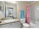 Cozy bathroom with a sink, toilet, and shower at 2550 N Alafaya Trl # 2304, Orlando, FL 32826