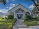 Beautiful clubhouse showcasing a pedestrian walkway and verdant landscaping enhancing its curb appeal at 2550 N Alafaya Trl # 2304, Orlando, FL 32826