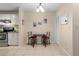 Bright dining area with tile floors and a view into the kitchen at 2550 N Alafaya Trl # 2304, Orlando, FL 32826
