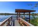 Picturesque gazebo overlooking tranquil lake with lush greenery and scenic waterfront at 2550 N Alafaya Trl # 2304, Orlando, FL 32826