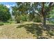 A serene, fenced-in backyard with mature trees and lots of space at 2710 W County Road 44, Eustis, FL 32726