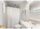 Bathroom featuring a shower with a curtain, a sink and mirror at 2710 W County Road 44, Eustis, FL 32726