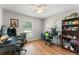 Office featuring hard wood floors, a ceiling fan and two desk set-ups at 2710 W County Road 44, Eustis, FL 32726