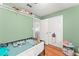 bedroom featuring hardwood floors, a closet and a window at 2710 W County Road 44, Eustis, FL 32726