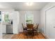 Bright breakfast nook with wood table and chairs next to the kitchen at 2710 W County Road 44, Eustis, FL 32726