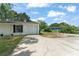 Well-maintained home exterior with ample parking space in the driveway at 2710 W County Road 44, Eustis, FL 32726