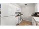 Functional kitchen with white appliances, cabinets, and countertops, offering ample storage at 2710 W County Road 44, Eustis, FL 32726