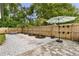 Landscaped backyard with stone pavers and a sun umbrella at 280 E Bay Ave, Longwood, FL 32750