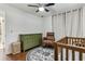Stylishly decorated Bedroom with hardwood floors, ceiling fan, and a coordinating area rug at 280 E Bay Ave, Longwood, FL 32750