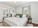 Serene bedroom featuring a king bed, natural light, and a mirrored closet for added convenience at 280 E Bay Ave, Longwood, FL 32750