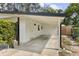 Exterior view of the carport showing ample parking space and clean design at 280 E Bay Ave, Longwood, FL 32750