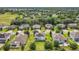A high aerial perspective shows a community with manicured lawns and mature trees at 3184 Pinenut Dr, Apopka, FL 32712