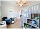 Bedroom features a gray bunk bed with steps and a blue arm chair at 3184 Pinenut Dr, Apopka, FL 32712