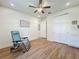 Light and airy bedroom featuring hardwood floors, ceiling fan, and closet, perfect for restful nights at 3184 Pinenut Dr, Apopka, FL 32712