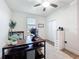 Bright bedroom/office with natural light, ceiling fan, and closet at 3184 Pinenut Dr, Apopka, FL 32712