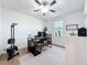 Bright bedroom/office with natural light, ceiling fan and exercise equipment at 3184 Pinenut Dr, Apopka, FL 32712