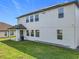 Exterior of home features solar panels and a well-manicured lawn at 3184 Pinenut Dr, Apopka, FL 32712