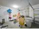 Spacious two car garage features a white door and organized storage at 3184 Pinenut Dr, Apopka, FL 32712