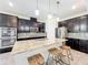 Beautiful kitchen featuring stainless steel appliances, granite countertops, and dark wood cabinetry at 3184 Pinenut Dr, Apopka, FL 32712