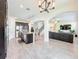 Spacious kitchen with stainless steel appliances, a granite island, and open access to the living area at 3184 Pinenut Dr, Apopka, FL 32712