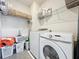 Clean laundry room features a Samsung washer and dryer set and wire shelving at 3184 Pinenut Dr, Apopka, FL 32712