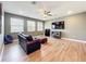 Upstairs loft area with wood floors, comfortable couch and television at 3184 Pinenut Dr, Apopka, FL 32712
