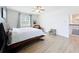 Spacious main bedroom with light wood floors, sitting area, and staircase access, offering comfort and convenience at 3184 Pinenut Dr, Apopka, FL 32712