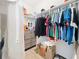 Functional walk-in closet featuring rods, shelves, and a floor-level storage solution for optimum organization at 3184 Pinenut Dr, Apopka, FL 32712
