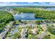 Beautiful residences nestled next to a large serene lake featuring a community pool and ample parking for residents at 3249 Sandy Shore Ln, Kissimmee, FL 34743