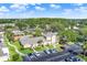 Aerial view featuring community with pool, lush trees and landscaping offering resort-style amenities at 3249 Sandy Shore Ln, Kissimmee, FL 34743