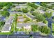 A beautiful aerial view of a multi-Gathering community with mature trees, ample parking and a sparkling pool at 3249 Sandy Shore Ln, Kissimmee, FL 34743