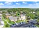 Aerial view highlighting community pool, landscaping, and proximity to parking at 3249 Sandy Shore Ln, Kissimmee, FL 34743
