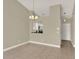 Open dining room with tile floors and a view of the kitchen at 3249 Sandy Shore Ln, Kissimmee, FL 34743