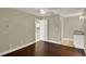 Versatile flex room with hardwood floors and a kitchenette, perfect for a guest suite or home office at 3249 Sandy Shore Ln, Kissimmee, FL 34743