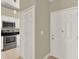 Bright entryway with tiled floors, a coat closet, and direct access to the updated kitchen at 3249 Sandy Shore Ln, Kissimmee, FL 34743