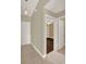 Inviting hallway with tile flooring leading to a bedroom with hardwood floors and a ceiling fan at 3249 Sandy Shore Ln, Kissimmee, FL 34743
