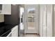 Bright kitchen with stainless steel appliances and a door to the outside at 3249 Sandy Shore Ln, Kissimmee, FL 34743