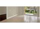 Living room featuring tile floors and sliding glass doors to the outside at 3249 Sandy Shore Ln, Kissimmee, FL 34743