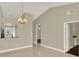 Living room with tile floors, view to kitchen, and plenty of natural light at 3249 Sandy Shore Ln, Kissimmee, FL 34743