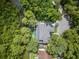 Overhead view of the beautiful home, backyard and lush green landscape at 33 Eastwind Ln, Maitland, FL 32751