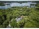 Aerial view showcasing the property's lush greenery, serene lake, and beautiful surroundings at 33 Eastwind Ln, Maitland, FL 32751
