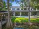 Beautiful backyard with pool, covered patio, and lush greenery providing privacy at 33 Eastwind Ln, Maitland, FL 32751