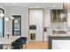 Bright kitchen featuring modern white cabinets, state-of-the-art appliances, and sleek countertop with a dining area at 33 Eastwind Ln, Maitland, FL 32751