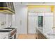 Modern kitchen with white cabinets, stainless steel appliances, and a stylish design at 33 Eastwind Ln, Maitland, FL 32751