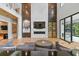Spacious living room with fireplace, modern furnishings, and natural light at 33 Eastwind Ln, Maitland, FL 32751