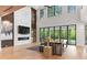 Bright living room with high ceilings, fireplace, and seamless indoor-outdoor flow at 33 Eastwind Ln, Maitland, FL 32751
