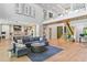 Open concept living room with modern decor, soaring ceilings, and a seamless flow at 33 Eastwind Ln, Maitland, FL 32751