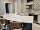 Contemporary bar area with a stunning countertop, stylish seating, and beverage storage for entertainment at 3371 Yellowtop Loop, Clermont, FL 34714