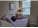 Cozy bedroom with a daybed, soft lighting, and a window view at 3371 Yellowtop Loop, Clermont, FL 34714